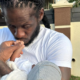 PHOTO Aidonia gets Cozy With his New Born featured image