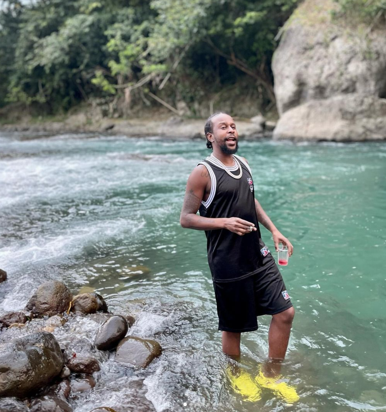 Popcaan at the river in Jamaica