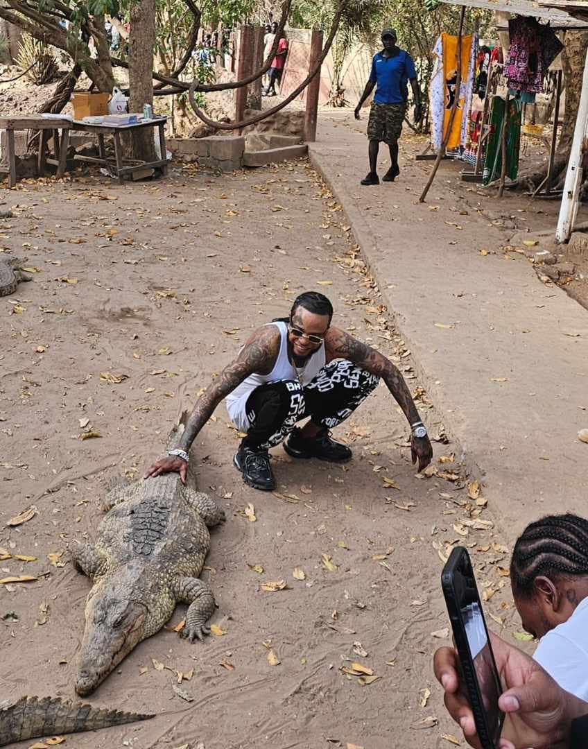 Tommy Lee Sparta pets Crocodile in Africa